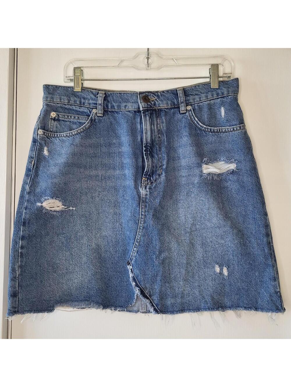 Free People distressed denim mini skirt,  medium wash, frayed hem  size 30